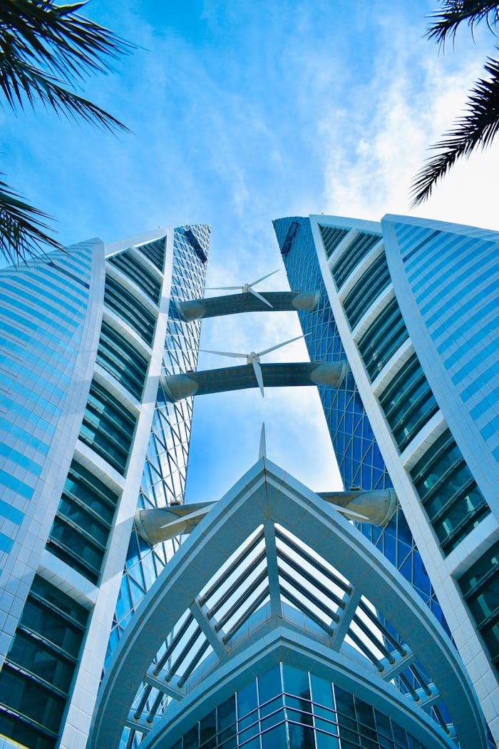 Low angle view of the Manama Twin Towers showcasing modern architecture in Bahrain.